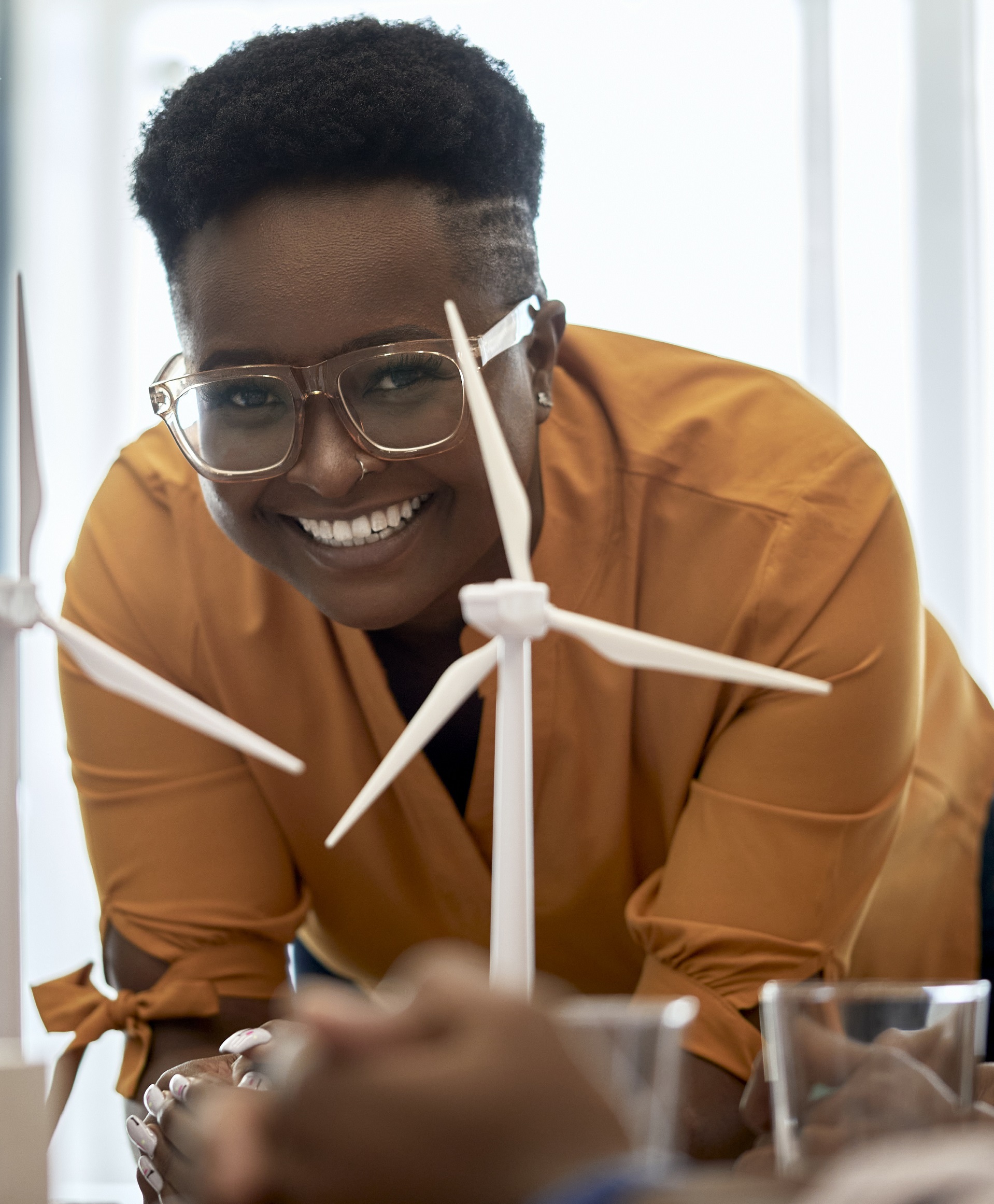 Young woman with windmill models