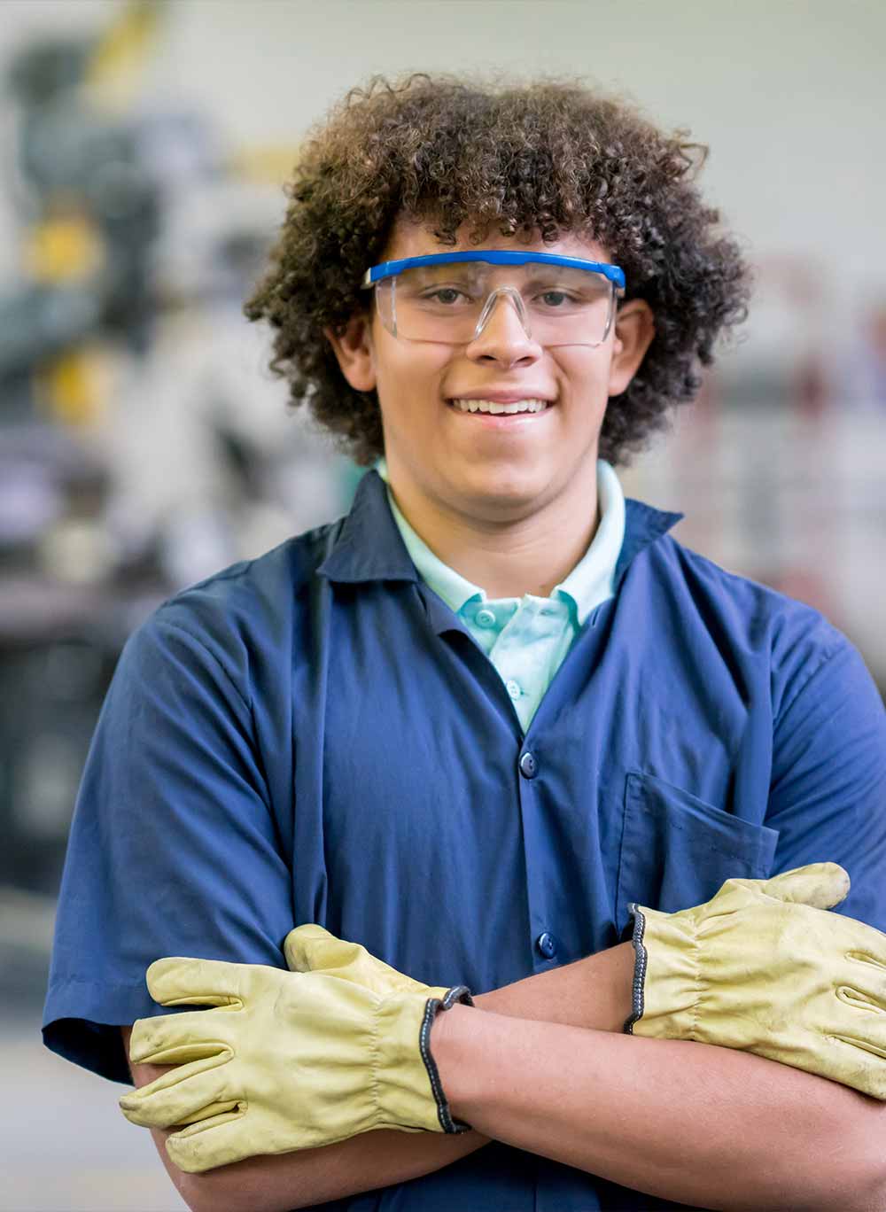 Portrait of a male engineering student in a workshop 