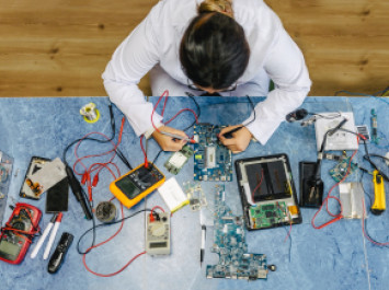 Overhead view of girl at a work bench