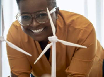 Smiling female with windmills